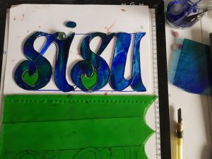 Sisu letters cut in glass