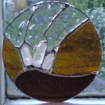 Red and amber quartz crystal stained glass roundel